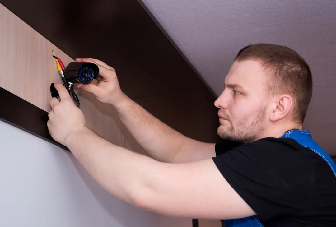 Technician measuring in a residential attic