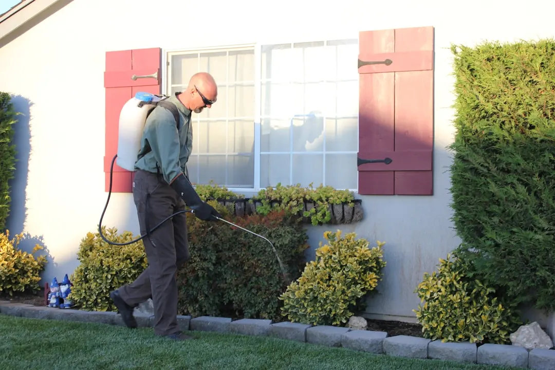 Pest-control technician working at a home